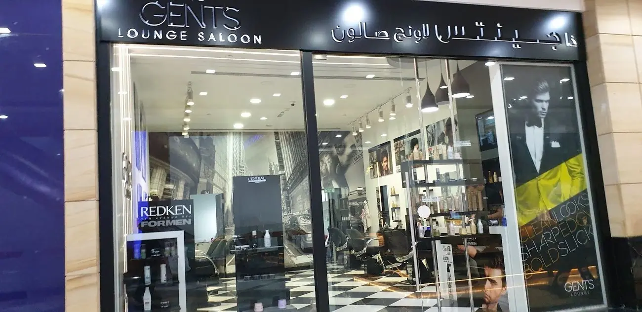 The Gent's Lounge Saloon shopfront, its sign in English and Arabic